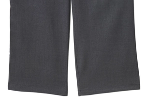 Detailed close-up of dark grey twill fabric hem with precise double stitching