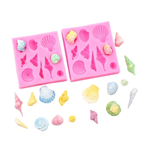 Detail of pink silicone mold with various seashell shapes for DIY cake decorating