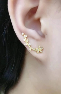 Elegant gold flower ear crawler earrings with zircon inlays for a nature-inspired look