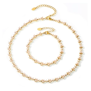 Elegant gold-plated stainless steel jewelry set featuring white pearl floral clusters