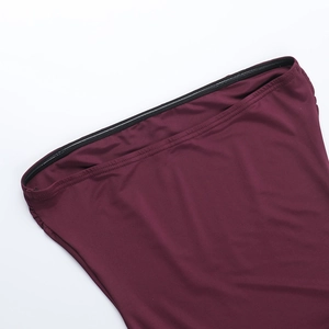 Macro view of burgundy dress neckline with non-slip silicone tape for extra stability