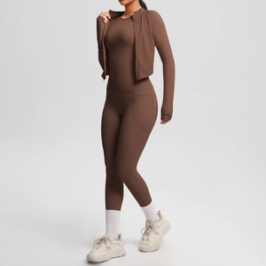 Three-piece mocha brown yoga set featuring a slim vest, zipper jacket and high waist leggings