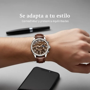 Brown leather chronograph watch on wrist with business accessories in a lifestyle scene