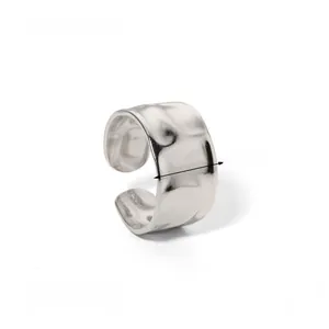 Detail view of 11mm wide adjustable silver steel ring with irregular hammered texture