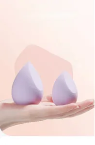 Purple teardrop makeup sponge size comparison showing expansion from dry to wet states