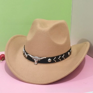Detail of light brown western cowboy wool hat featuring silver bull head emblem and studs
