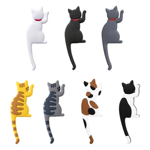 Set of seven creative cat tail magnetic hooks in various colors for home decoration