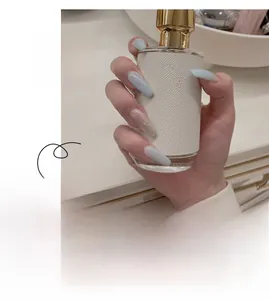 Detailed view of light blue ballerina press-on nails with silver glitter accent JP1163