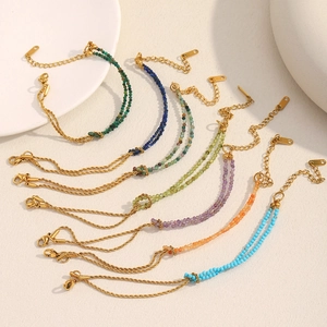 Close-up of 18K gold plated twist chain bracelets with multi-color natural stones and clasp