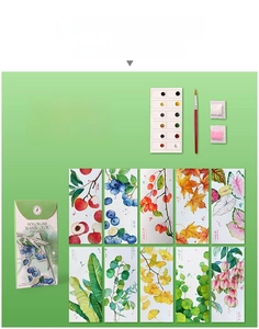 Flat lay of watercolor DIY bookmark set featuring 12 colors, 10 plant cards, and glitters