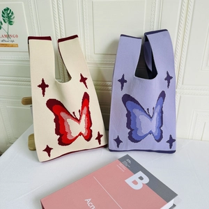 Detailed macro view of high-quality knit tote bags with elegant butterfly and star patterns