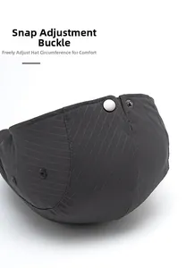 Detail of adjustable metal buckle and striped fabric on dark grey beret hat back