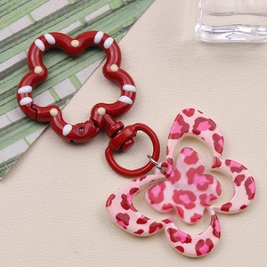 Pink leopard print butterfly acrylic keychain with a red flower spring clasp