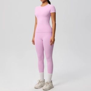 Close-up of pink yoga set showing pocket detail and breathable sports fabric texture