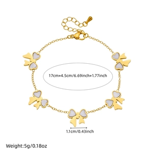 Gold plated stainless steel bracelet with white bow charms and 17cm plus 4.5cm length