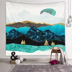 Detail view of abstract mountain tapestry with gold outlines in a modern home interior