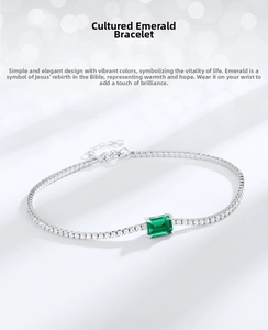 Macro detail of S925 silver tennis bracelet featuring emerald-cut lab emerald and diamonds