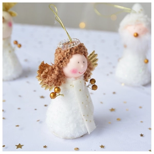 Detail of plush Christmas angel hanging ornament with gold accents and sparkling star background