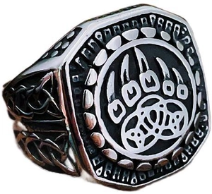 Detailed engraving of Celtic knots and bear paw totem on a vintage stainless steel ring