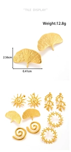 Detailed set of gold stainless steel earrings featuring ginkgo leaf and solar spiral designs