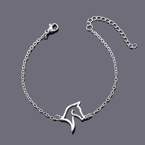 Detailed view of the lobster clasp and adjustable tail chain on a horse head bracelet