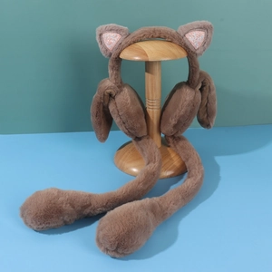 Detail of plush brown cat ear muffs with sequins and movable air pump paws