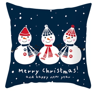 Close-up of blue Christmas pillowcase with three snowmen and Merry Christmas text