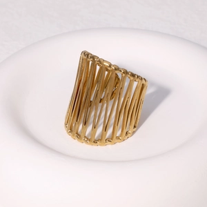 Modern 18k gold plated stainless steel multi-layered crossover band ring on white pedestal