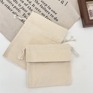 Detail of drawstring canvas pouches showing high-quality cotton texture and durable ropes