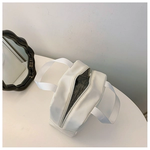 Detail view of insulated white lunch bag with durable thermal aluminum foil lining
