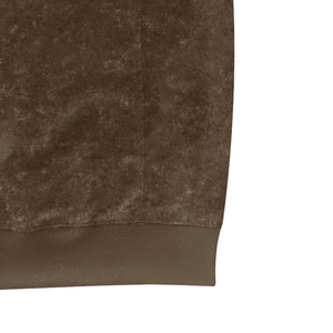 Detailed close-up of vintage washed fabric and ribbed hem on a brown hooded tank top
