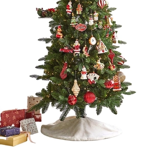 White faux fur Christmas tree skirt with festive ornaments and warm light ambiance