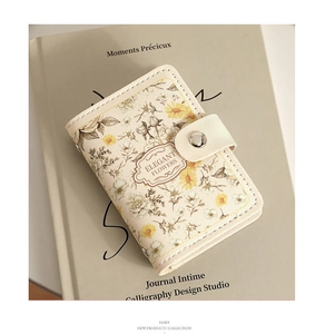 Detailed view of floral pattern and elegant flower label on a beige PU leather card holder