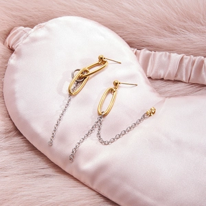 Minimalist bicolor chain tassel earrings with gold oval link and silver chain detail