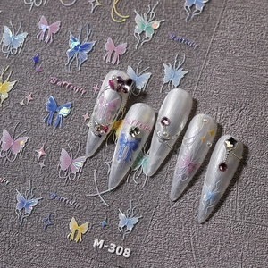 Golden butterfly nail stickers with iridescent star motifs and pearl accents for luxury manicure
