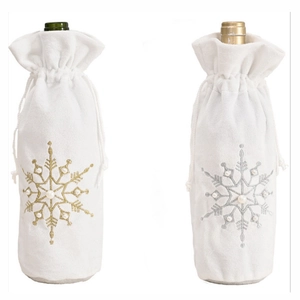 White Christmas wine bottle covers with gold and silver embroidered beaded snowflakes