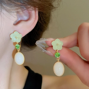 Elegant Chinese style floral drop earrings with green stones and white resin charms