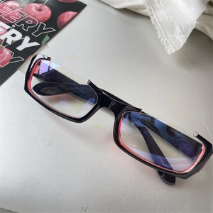 Retro black and red rectangular half-rim glasses frame with clear lenses in a 45-degree view