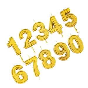 Set of 10 golden number birthday candles from zero to nine on a clean white background