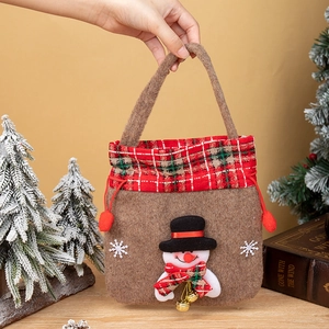 Close-up of brown felt Christmas gift bag featuring a 3D snowman and festive bells