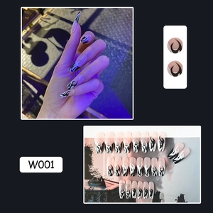 Close-up of black and white flame pattern on long coffin-shaped press-on nails