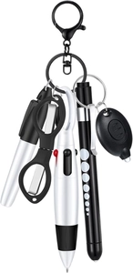 Detail of multi-tool keychain featuring folding scissors, LED flashlight and metal ballpoint pen