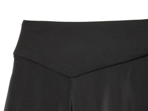 Detail of the high-waisted black leggings showing the V-shaped back seam stitching