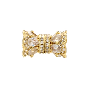 Close-up of gold-plated bow charm with pavé cubic zirconia for DIY jewelry making