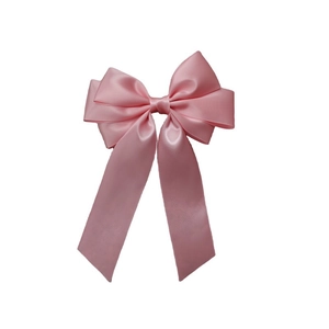 Detailed view of the layered pink satin ribbon bow hair clip with smooth texture