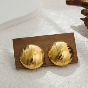 Detail of 18K gold stainless steel round stud earrings with vertical striped texture