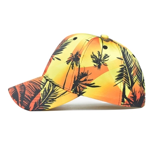 Tropical sunset baseball cap with yellow orange gradient and black coconut tree print