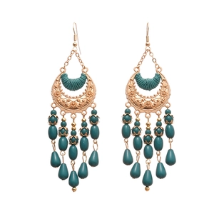 Bohemian crescent moon drop earrings with deep teal beads and intricate floral engravings