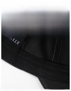 Detail of wide moisture-wicking sweatband and fine stitching inside the black baseball cap