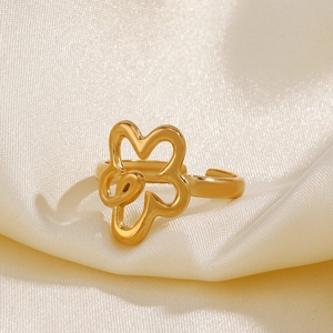 Exaggerated stainless steel hollow flower ring with an adjustable open gold finish